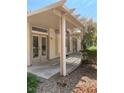 Relaxing covered patio with a pergola, neutral colors, and views of lush landscaping at 1742 Franklin Chase Ter, Henderson, NV 89012