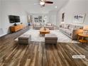 Inviting living room featuring hardwood floors, lots of seating, and ample natural light at 2456 Palmridge Dr, Las Vegas, NV 89134