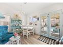 Cozy dining area featuring stylish decor and access to a backyard pool through glass doors at 266 Corvallis Ct, Henderson, NV 89074