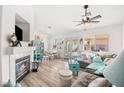 Bright living room with a fireplace and backyard access, seamlessly blending indoor and outdoor living at 266 Corvallis Ct, Henderson, NV 89074