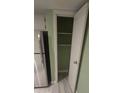 Open door reveals a pantry with shelving for ample storage at 2981 Country Manor Ln # 2, Las Vegas, NV 89115