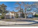 Corner lot home with a well-manicured front yard and mature trees at 3665 Bronco Rd, Las Vegas, NV 89103