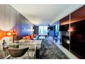 Stylish living room featuring a modern workspace, sleek furniture, and cityscape view at 4381 W Flamingo Rd # 2322/2320, Las Vegas, NV 89103