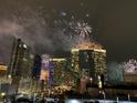 Night cityscape view showcasing vibrant fireworks display over lit Aria hotel and surrounding city at 4525 Dean Martin Dr # 607, Las Vegas, NV 89103