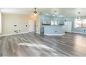 Open-concept living room with light gray flooring and neutral paint tones at 5282 Panguitch Dr, Las Vegas, NV 89122