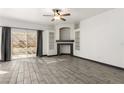 Bright living room with tile floors, recessed lighting, and decorative fireplace at 6201 E Lake Mead Blvd # 156, Las Vegas, NV 89156