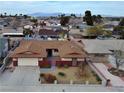Charming single-story home featuring a two-car garage and a well landscaped front yard at 6216 Bullion Blvd, Las Vegas, NV 89103