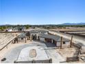 Beautiful single-story home showing circular driveway and desert landscape with mountain views at 6383 Horse Dr, Las Vegas, NV 89131