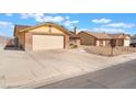 Single-story home featuring a two-car garage and a well-maintained lawn at 6408 Starcrest Dr, Las Vegas, NV 89108