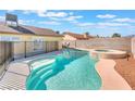 Inviting in-ground pool with walk-in steps and a connected hot tub at 6408 Starcrest Dr, Las Vegas, NV 89108