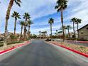 A street lined with beautiful palm trees at Grand Canyon Homes Village condominium community at 8250 N Grand Canyon Dr # 1139, Las Vegas, NV 89166