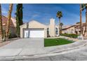 Charming single-story home with a well-manicured front yard, desert landscaping, and attached garage at 9808 Eagle Rock Ct, Las Vegas, NV 89117