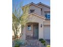 Cozy front porch with seating area, featuring a charming entrance and landscaped surroundings, creating a welcoming atmosphere at 9935 Fletcher Peak Ave, Las Vegas, NV 89178