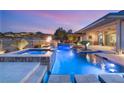 Beautiful swimming pool and spa featuring elegant tile work and lighting for a luxurious outdoor experience at 12 Wade Hampton Trl, Henderson, NV 89052