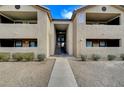 Building exterior featuring a pathway, landscaping and stair access to units at 2451 N Rainbow Blvd # 1150, Las Vegas, NV 89108