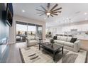 Bright living room featuring a fireplace, balcony access, and open layout to the kitchen at 350 Robledo St, Las Vegas, NV 89138