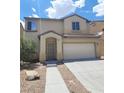 Front exterior view of a home with desert landscaping and an attached two car garage at 4039 Meadow Foxtail Dr, Las Vegas, NV 89122