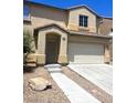 Two-story home with a two car garage and a desert landscaped yard at 4039 Meadow Foxtail Dr, Las Vegas, NV 89122