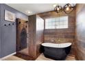 Modern bathroom featuring a soaking tub, walk-in shower, and stylish fixtures at 5049 Forest Oaks Dr, Las Vegas, NV 89149