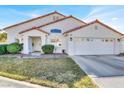 Charming single-Gathering home boasts a well-kept lawn and a convenient two-car garage at 5049 Forest Oaks Dr, Las Vegas, NV 89149