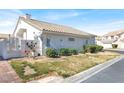 Lovely home showcasing a side entrance and well-placed landscaping at 5049 Forest Oaks Dr, Las Vegas, NV 89149