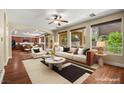 Inviting staged living room with archway, hardwood floors, and abundant natural light at 505 Los Dolces St, Las Vegas, NV 89138