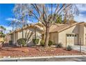 Beautiful single-story home with well-maintained landscaping, a driveway, and a two-car garage at 5216 Las Cruces Dr, Las Vegas, NV 89130