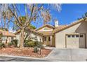 Inviting single-story home boasting a tidy yard, mature trees, and a convenient attached garage at 5216 Las Cruces Dr, Las Vegas, NV 89130