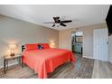 Bedroom with ceiling fan and bathroom access at 524 Turtleback Rd # A, Mesquite, NV 89027