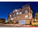 Contemporary three-story townhouse with private garages and modern architectural details at 639 Grey Saker St, Las Vegas, NV 89138