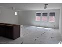 Bright and open living room with ample natural light and a neutral color palette at 6616 Bowery St, Las Vegas, NV 89148