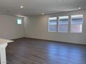 Bright living room features recessed lighting and large windows for plenty of natural light and scenic views at 6616 Bowery St, Las Vegas, NV 89148