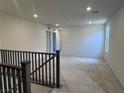 Open loft area with neutral carpeting and lots of natural light at 6616 Bowery St, Las Vegas, NV 89148