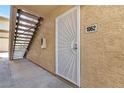 Close-up of unit entrance featuring security door and unit number 1062 at 7300 Pirates Cove Rd # 1062, Las Vegas, NV 89145