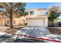 Charming two-story home featuring a classic design, two-car garage, and a well-maintained front yard at 7752 Orchard Wood Ct, Las Vegas, NV 89131