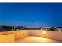 Rooftop deck with views of the city skyline and palm trees at 8012 Carpenter Creek Ave, Las Vegas, NV 89113