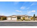 Charming single-story home with a brick driveway and a three-car garage at 9240 Northfield Park Ct, Las Vegas, NV 89148