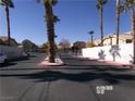 A street view of the community entrance with palm trees and well-maintained landscaping at 1401 N Michael Way # 239, Las Vegas, NV 89108