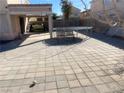 View of the backyard featuring an installed patio area with ample space and a covered seating area at 2291 Grannis Ln, Las Vegas, NV 89104