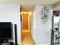 Hallway with tile flooring featuring a decorative mirror and access to other rooms at 2609 Sierra Madre Dr, Las Vegas, NV 89102