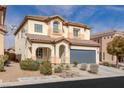 Inviting two-story home with a two-car garage and well-manicured front yard at 5596 Danforth Ave, Las Vegas, NV 89141