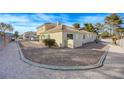 Beautiful exterior view showcasing well-maintained landscaping and a two-story townhome layout at 691 Anne Ln # 0, Henderson, NV 89015