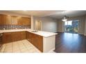 Spacious kitchen with white countertops open to a modern living space at 8255 Las Vegas Blvd # 415, Las Vegas, NV 89123