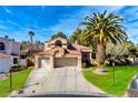 Charming two-story home with a three car garage, tiled roof, and manicured front yard at 229 Drysdale Cir, Henderson, NV 89074