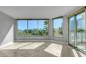 A bright living room with expansive windows and a sliding glass door with a great view at 322 Karen Ave # 201, Las Vegas, NV 89109