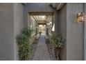 Inviting walkway to the front door with landscaped greenery and a charming gate at 420 Pinnacle Heights Ln, Las Vegas, NV 89144