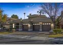 Attractive home featuring a three-car garage and manicured landscaping at 420 Pinnacle Heights Ln, Las Vegas, NV 89144