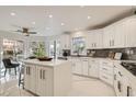 Bright, modern kitchen with white cabinetry, a center island, and stainless steel appliances providing form and function at 4961 Tierra Del Sol Dr, Las Vegas, NV 89113