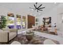Bright living room boasting modern decor and views of the pool area at 4961 Tierra Del Sol Dr, Las Vegas, NV 89113