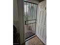 Entryway with screen door, tile floor, and white trim at 6624 Socorro Dr, Las Vegas, NV 89108